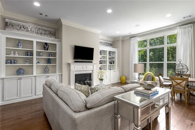 a kitchen with granite countertop white cabinets and sink