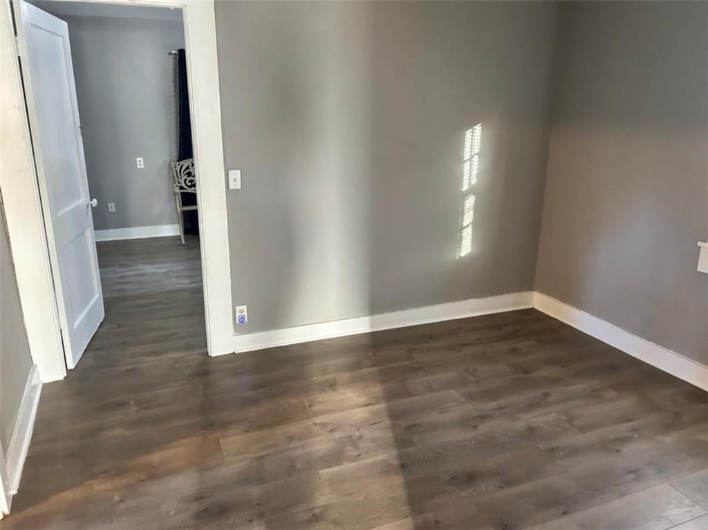 930 Cantrell Road Marble Hill, GA 30148 - Photo 12 of 37 an empty room with wooden floor and a window