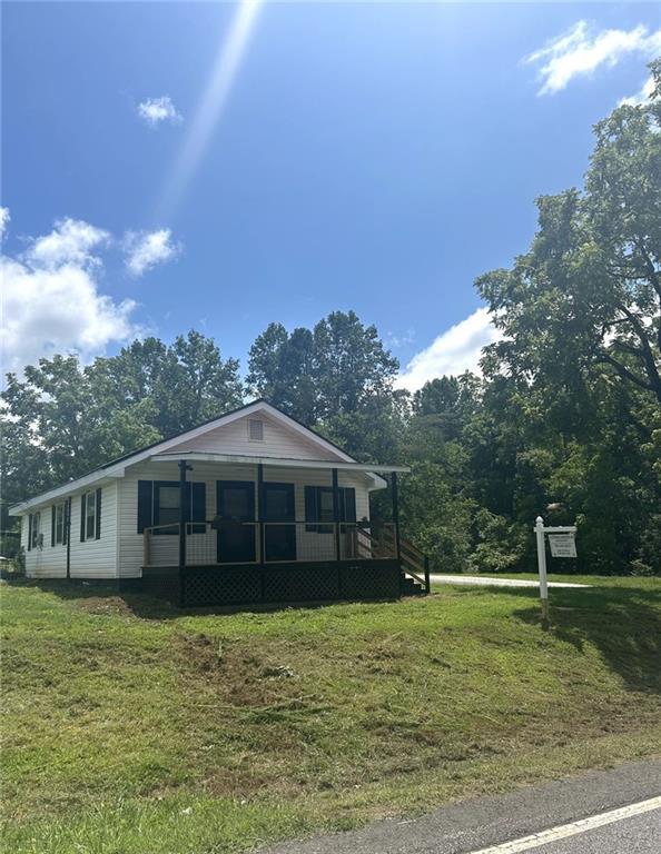 930 Cantrell Road Marble Hill, GA 30148 - Photo 16 of 37 a view of a house with a yard balcony and tree