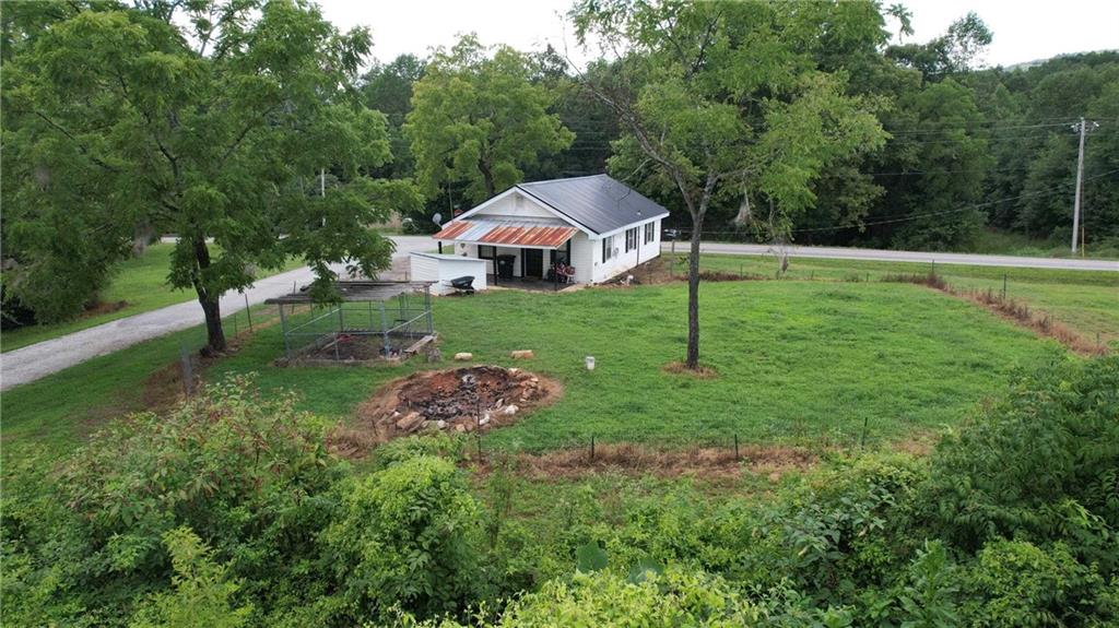 930 Cantrell Road Marble Hill, GA 30148 - Photo 23 of 37 a view of a house with a yard and sitting area