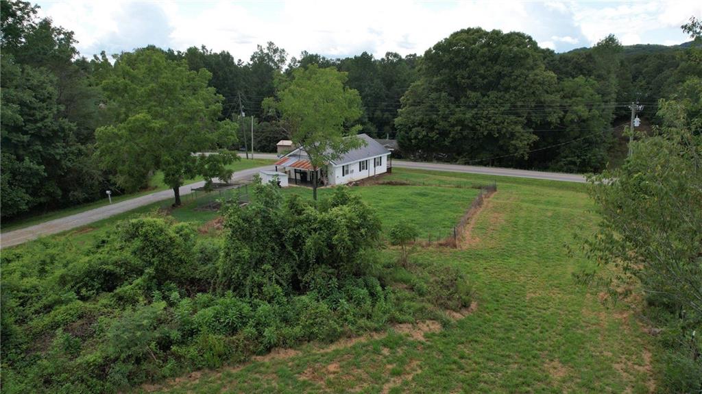 930 Cantrell Road Marble Hill, GA 30148 - Photo 24 of 37 a green field with lots of bushes