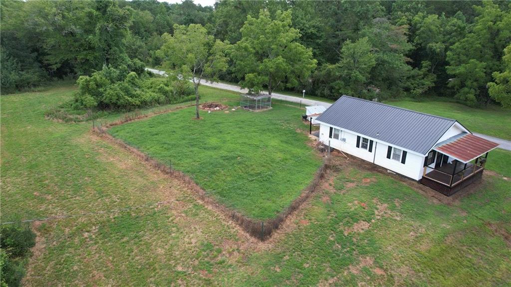 930 Cantrell Road Marble Hill, GA 30148 - Photo 26 of 37 an aerial view of residential house with outdoor space and trees around
