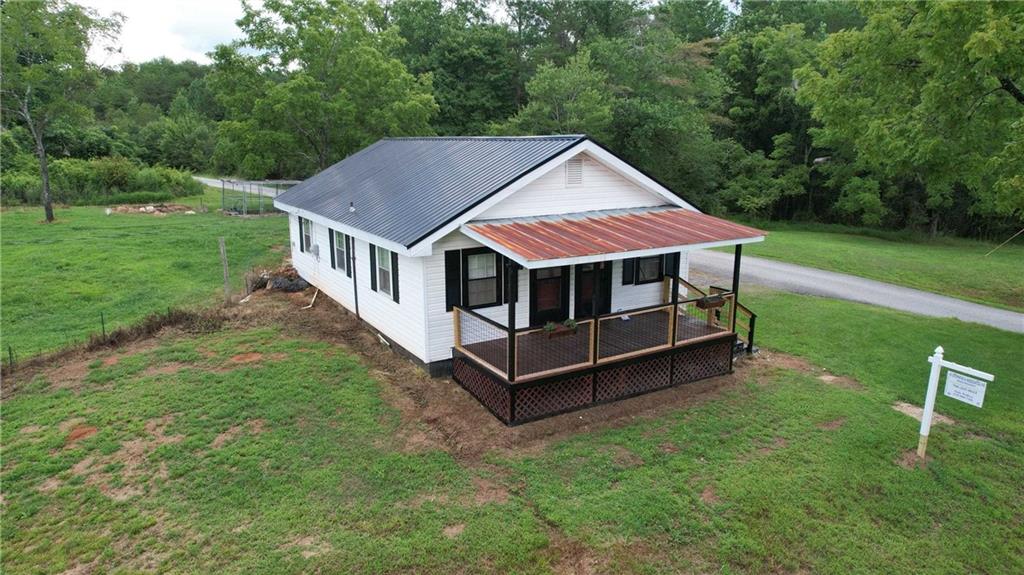 930 Cantrell Road Marble Hill, GA 30148 - Photo 27 of 37 a aerial view of a house with a yard