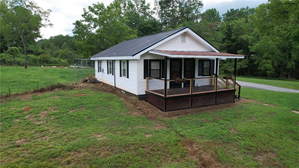 930 Cantrell Road Marble Hill, GA 30148 - Photo 28 of 37 a front view of a house with a garden