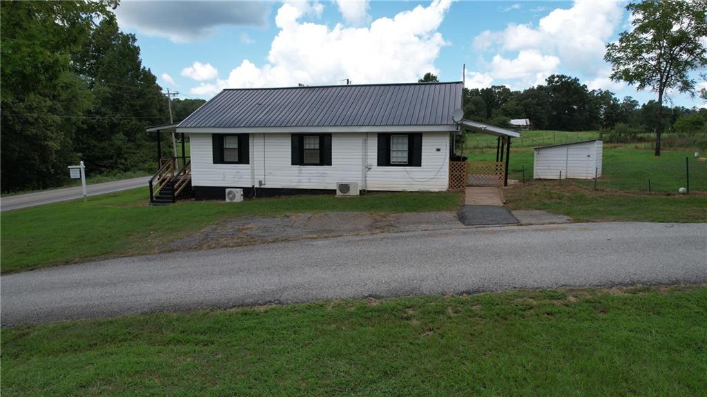 930 Cantrell Road Marble Hill, GA 30148 - Photo 30 of 37 a front view of a house with garden