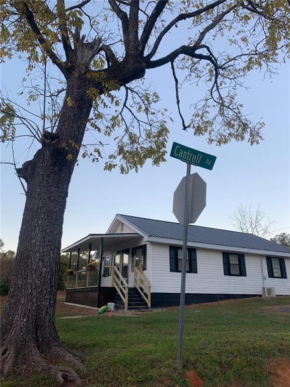 930 Cantrell Road Marble Hill, GA 30148 - Photo 3 of 37 a view of a house with a yard
