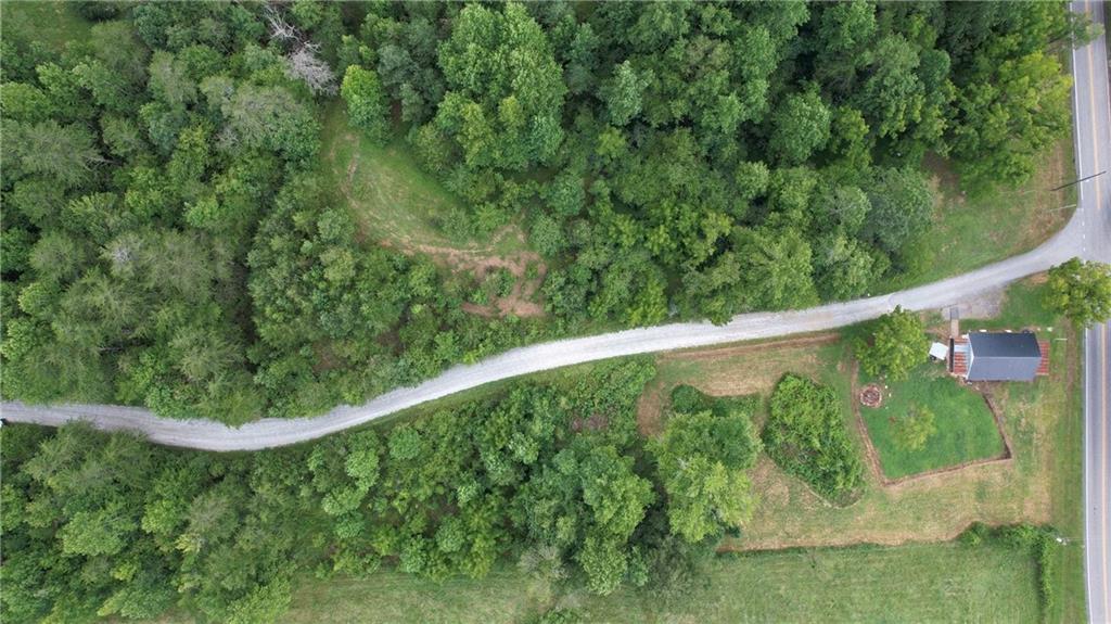 930 Cantrell Road Marble Hill, GA 30148 - Photo 33 of 37 a view of a lush green field with plants in the background