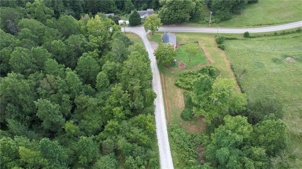 930 Cantrell Road Marble Hill, GA 30148 - Photo 34 of 37 an aerial view of a house with a yard