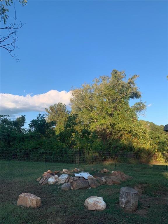 930 Cantrell Road Marble Hill, GA 30148 - Photo 4 of 37 a backyard of a house with lots of green space