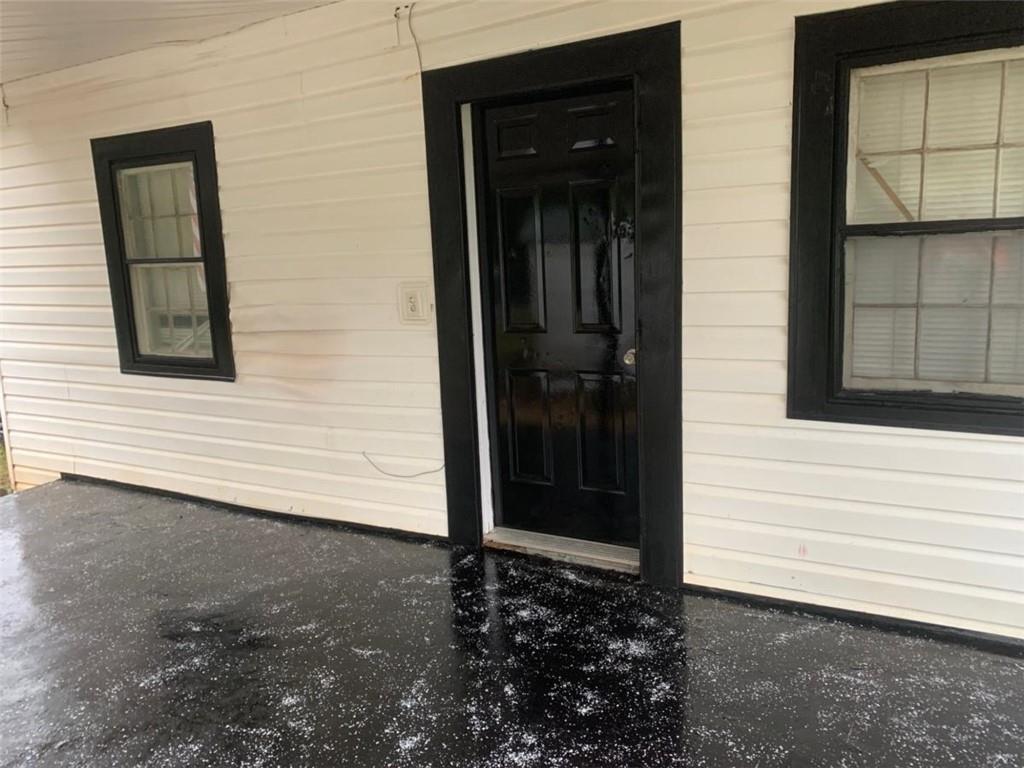930 Cantrell Road Marble Hill, GA 30148 - Photo 6 of 37 a view of a house with a door