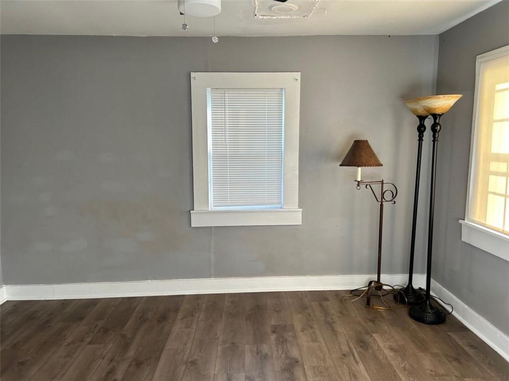 930 Cantrell Road Marble Hill, GA 30148 - Photo 9 of 37 an empty room with wooden floor and a window