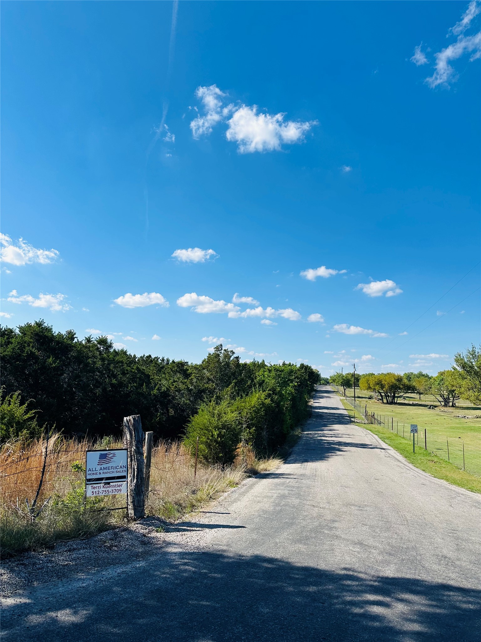 336 County Road 334 Roads Burnet, TX 78611 - Photo 4 of 11 Scenic paved road winds through lush, natural surroundings, offering tranquil access.