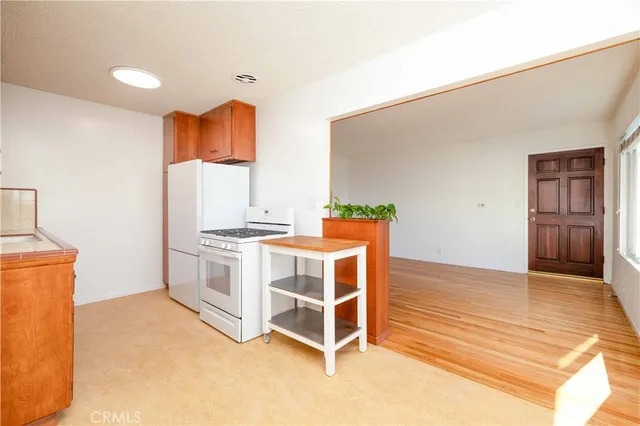 a kitchen that has a sink and a stove