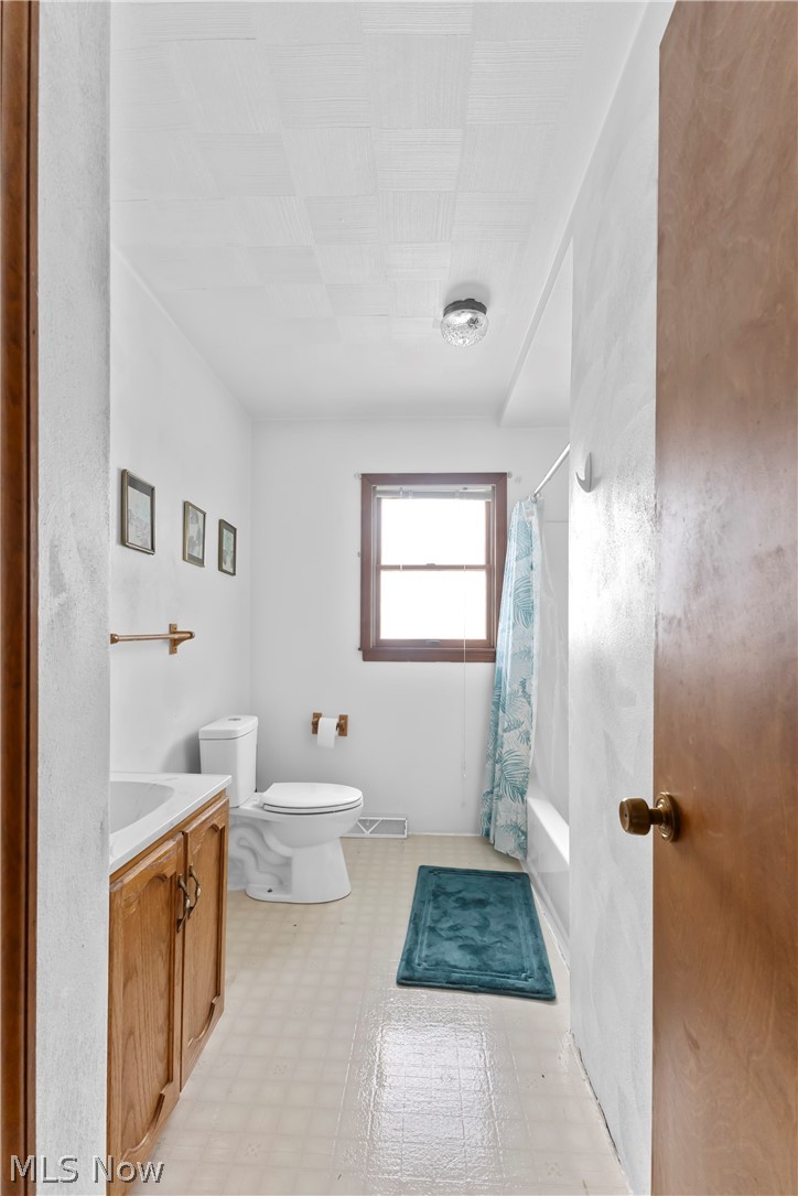 140 Iris Lane Colliers, WV 26035 - Photo 21 of 47 Full bathroom featuring shower / bath combination with curtain, vanity, and toilet