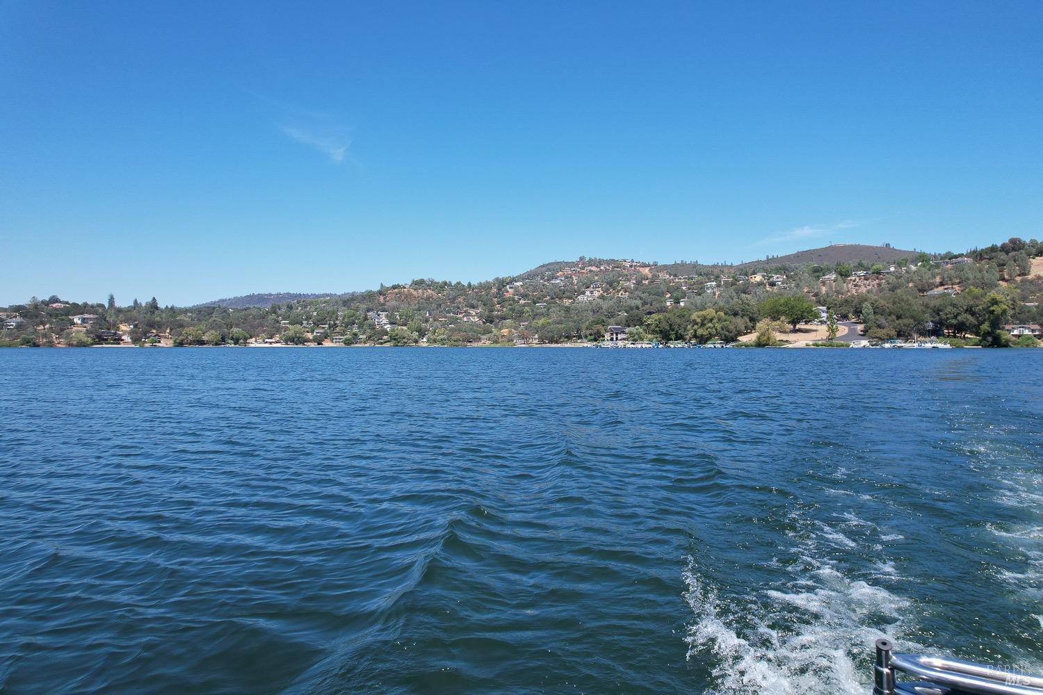 18903 Deer Hill Road Hidden Valley Lake, CA 95467 - Photo 19 of 32 Enjoy boating on private Hidden Valley Lake, boasting102 surface acres of water with 2 manicured beaches, BBQ pits, picnic tables, playgrounds, volley ball court, 2 large dive rafts, boat dock and easy launch pads for paddle boarding and kayaking! This lot is located in the safe and secure gated community of Hidden Valley Lake.