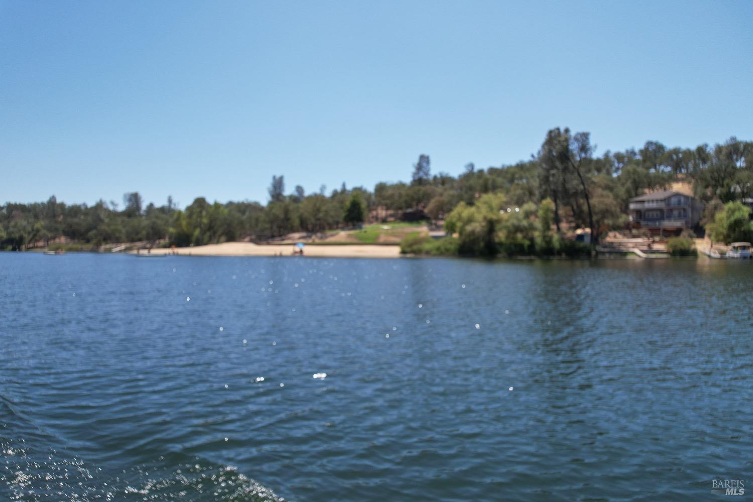 18903 Deer Hill Road Hidden Valley Lake, CA 95467 - Photo 20 of 32 Enjoy boating on private Hidden Valley Lake, boasting102 surface acres of water with 2 manicured beaches, BBQ pits, picnic tables, playgrounds, volley ball court, 2 large dive rafts, boat dock and easy launch pads for paddle boarding and kayaking! This lot is located in the safe and secure gated community of Hidden Valley Lake.