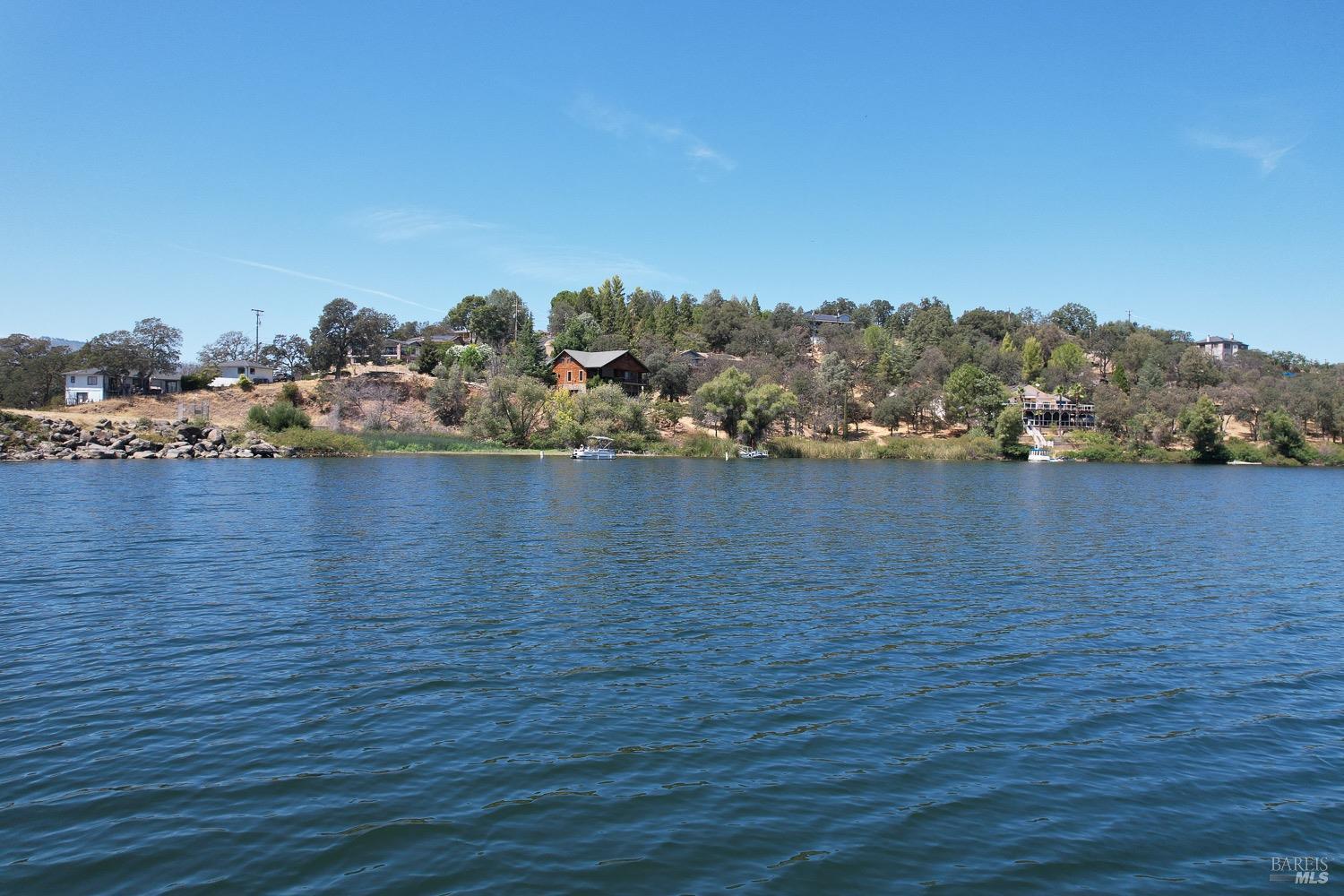 18903 Deer Hill Road Hidden Valley Lake, CA 95467 - Photo 21 of 32 Enjoy boating on private Hidden Valley Lake, boasting102 surface acres of water with 2 manicured beaches, BBQ pits, picnic tables, playgrounds, volley ball court, 2 large dive rafts, boat dock and easy launch pads for paddle boarding and kayaking! This lot is located in the safe and secure gated community of Hidden Valley Lake.