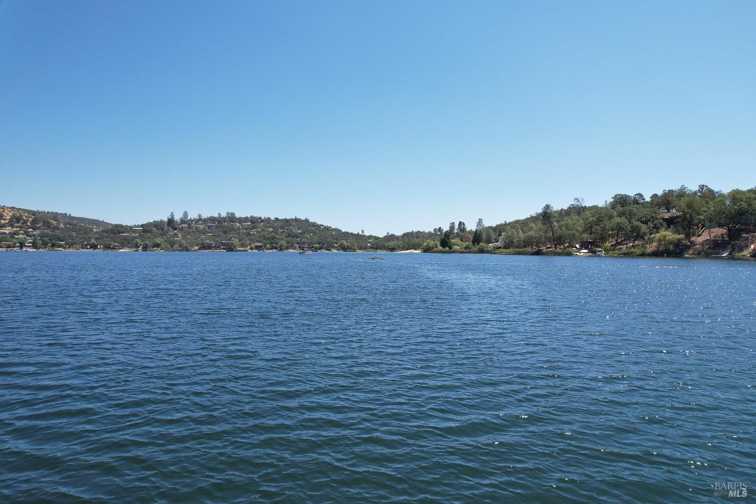 18903 Deer Hill Road Hidden Valley Lake, CA 95467 - Photo 22 of 32 Enjoy boating on private Hidden Valley Lake, boasting102 surface acres of water with 2 manicured beaches, BBQ pits, picnic tables, playgrounds, volley ball court, 2 large dive rafts, boat dock and easy launch pads for paddle boarding and kayaking! This lot is located in the safe and secure gated community of Hidden Valley Lake.