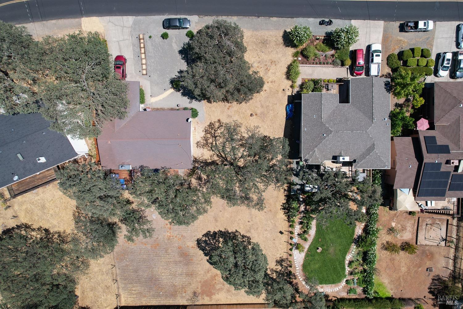 18903 Deer Hill Road Hidden Valley Lake, CA 95467 - Photo 5 of 32 An aerial view of the vacant lot for sale. The current owners live right next door and have a lot of similar size and topography. Buy this lot and create the yard of your dreams on this blank slate studded with beautiful Oak trees.
