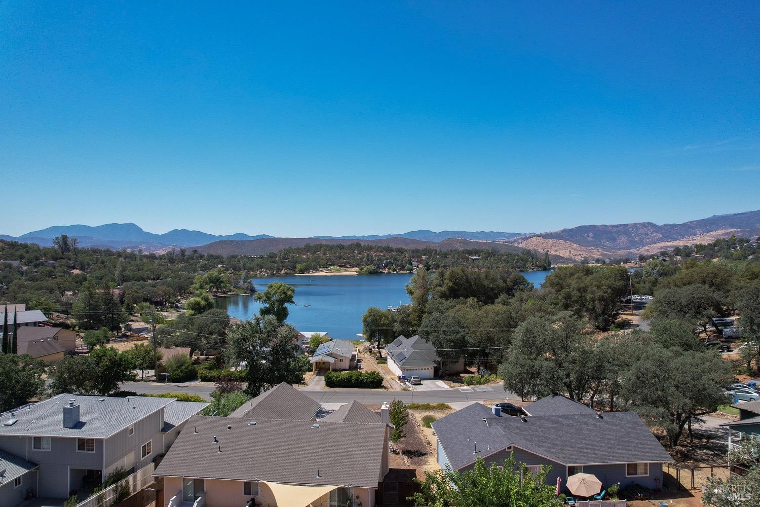 18903 Deer Hill Road Hidden Valley Lake, CA 95467 - Photo 6 of 32 An aerial view of the lake from over the vacant lot for sale.