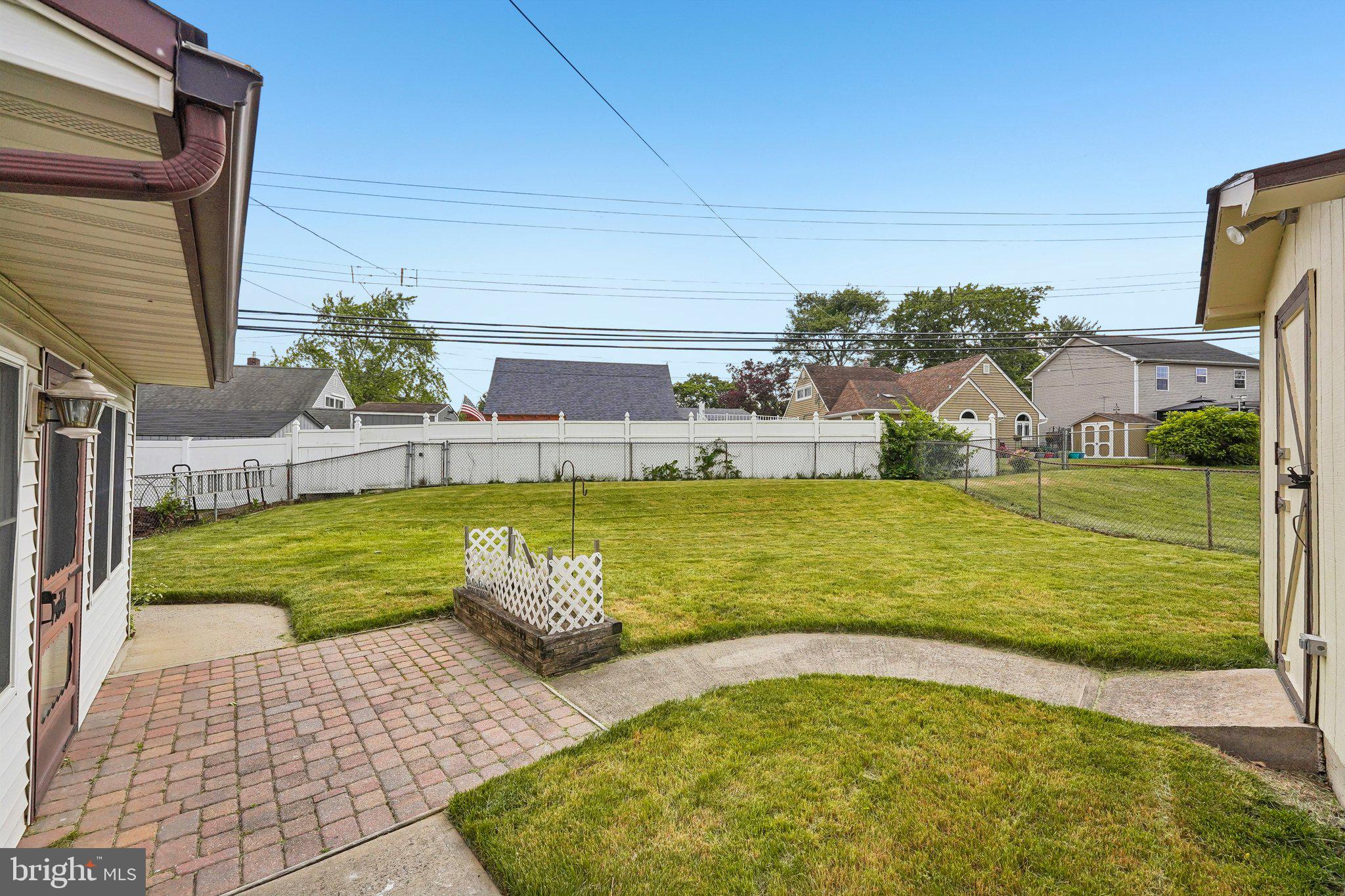 9 Rustleaf Lane Levittown, PA 19055 - Photo 4 of 45 Spacious backyard with lush greenery.