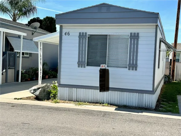 a front view of a house with a fence