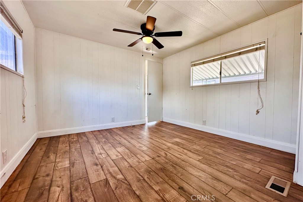 3825 Valley Boulevard, Unit 46 Walnut, CA 91789 - Photo 10 of 17 a view of empty room with wooden floor and fan