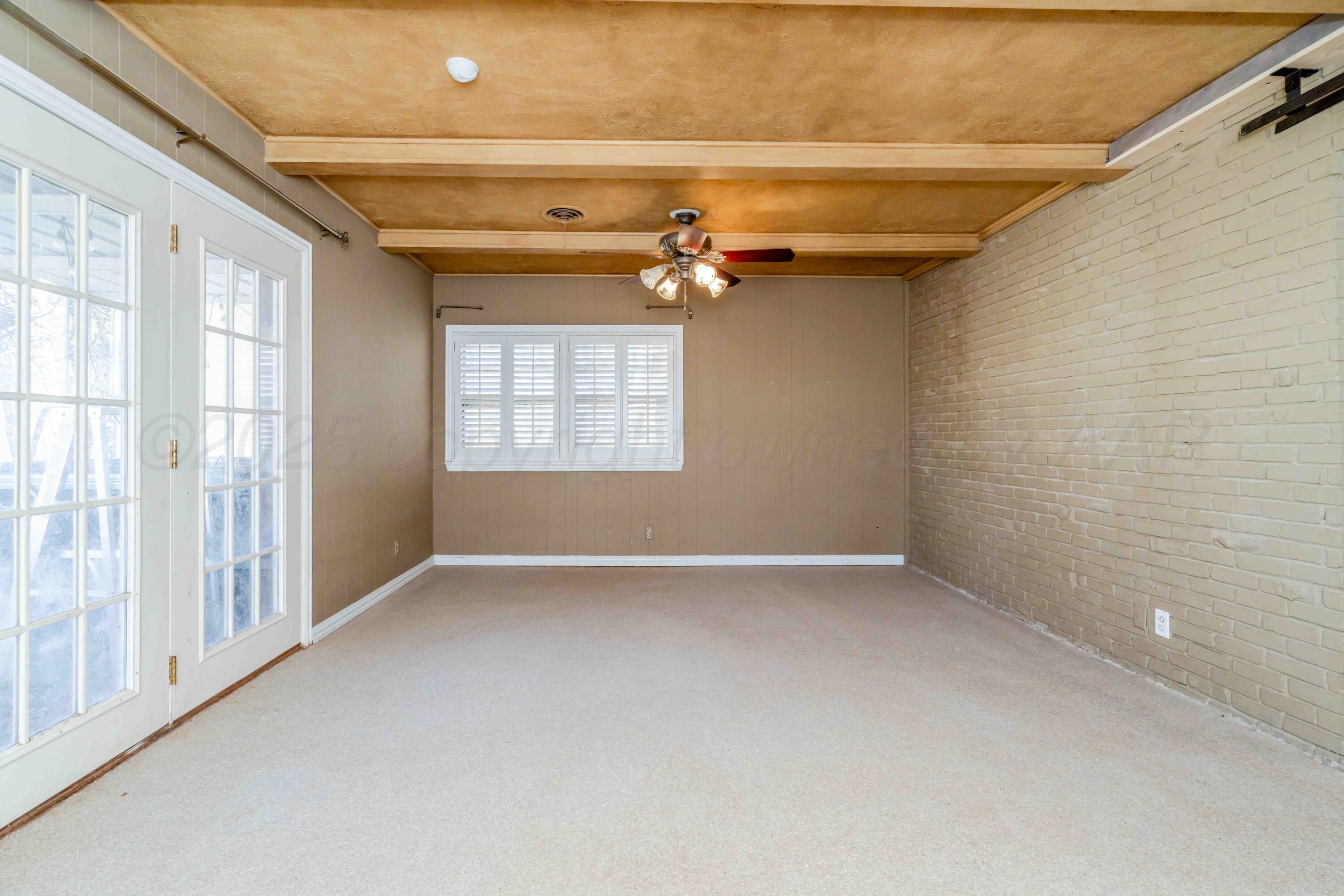39 Crockett Drive Tulia, TX 79088 - Photo 13 of 29 a view of an empty room with a window