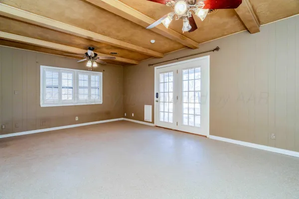 an empty room with windows