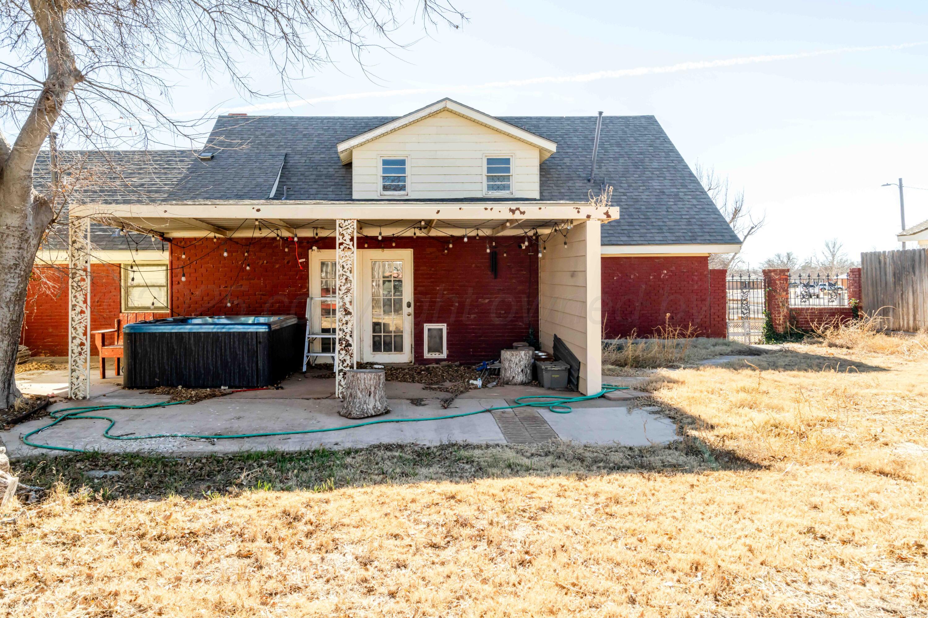 39 Crockett Drive Tulia, TX 79088 - Photo 29 of 29 a front view of a house with a yard and garage