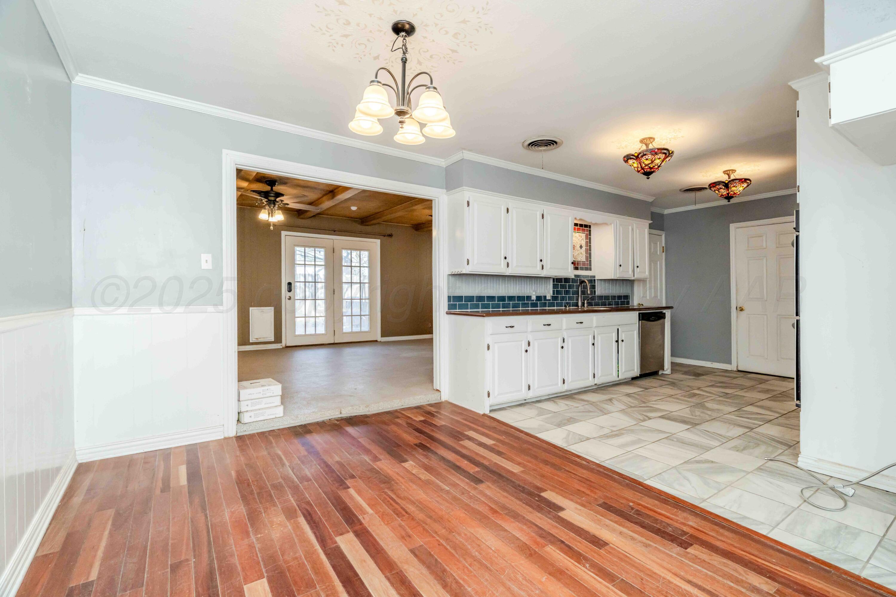 39 Crockett Drive Tulia, TX 79088 - Photo 10 of 29 a view of a kitchen with microwave and cabinets