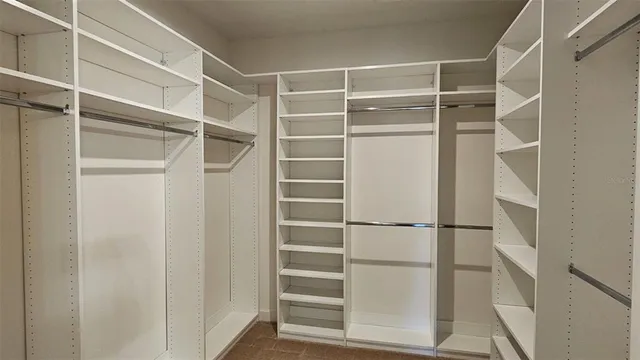 a view of an empty walk in closet