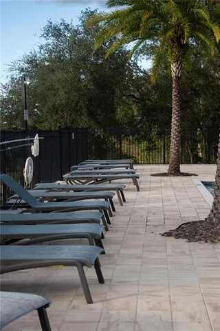 a view of backyard with trampoline
