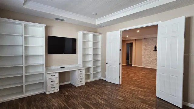 a view of a livingroom with furniture and wooden floor