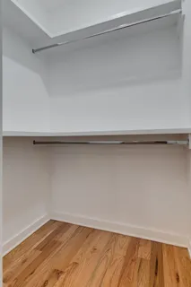 a view of a room with shelf on the wall