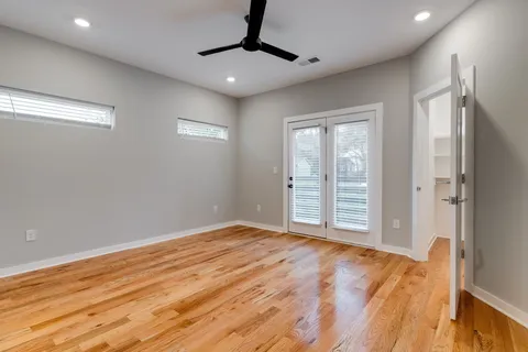 a view of an empty room with glass door