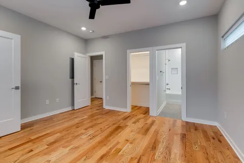 a bedroom with a bed and a dresser