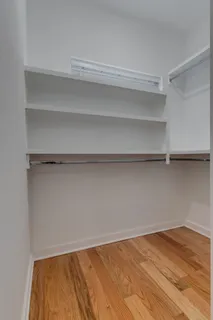 a view of a room with shelf on the wall