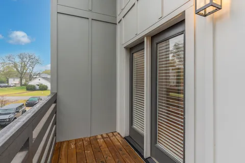 a view of a room with wooden floor and fence