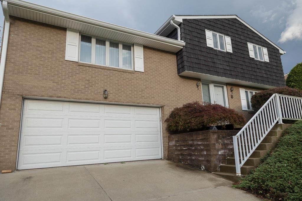 11 Crestwood Drive Cecil, PA 15321 - Photo 2 of 30 a front view of a house with garage