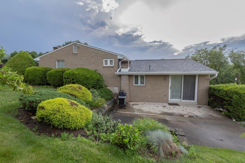 11 Crestwood Drive Cecil, PA 15321 - Photo 3 of 30 a front view of a house with a garden and plants