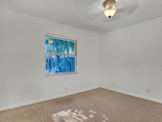 a view of a glass door with a yard