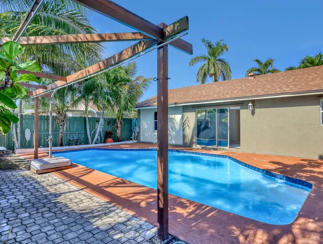 a view of a swimming pool with a patio