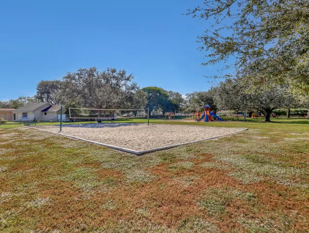 a view of outdoor space with swimming pool and green space
