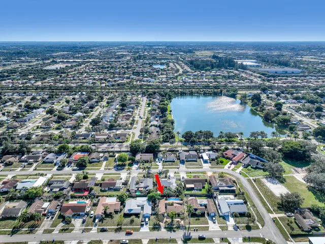 an aerial view of a house with outdoor space