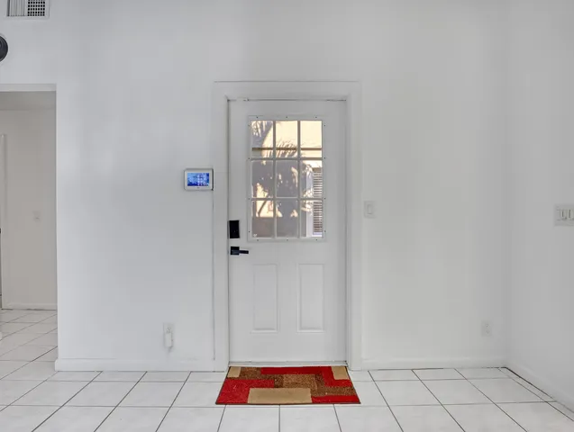 a room with white walls and a window