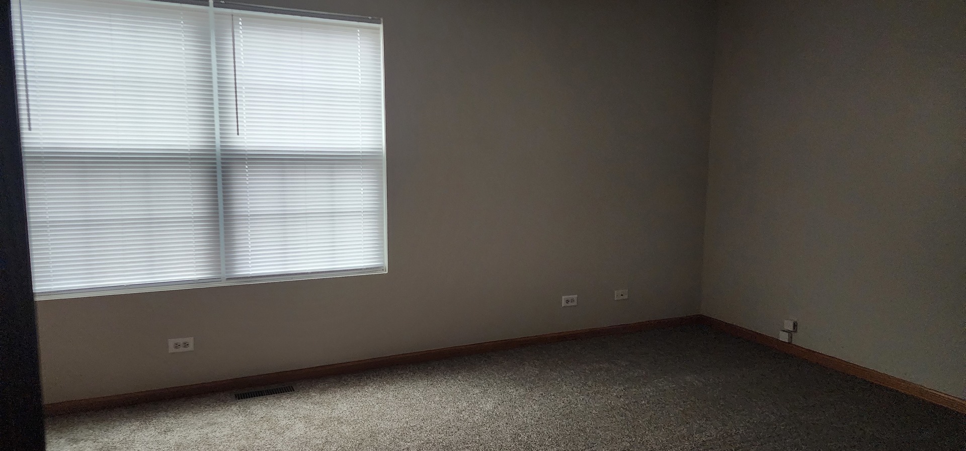 4561 Garritano Street, Unit B Yorkville, IL 60560 - Photo 5 of 11 an empty room with a window