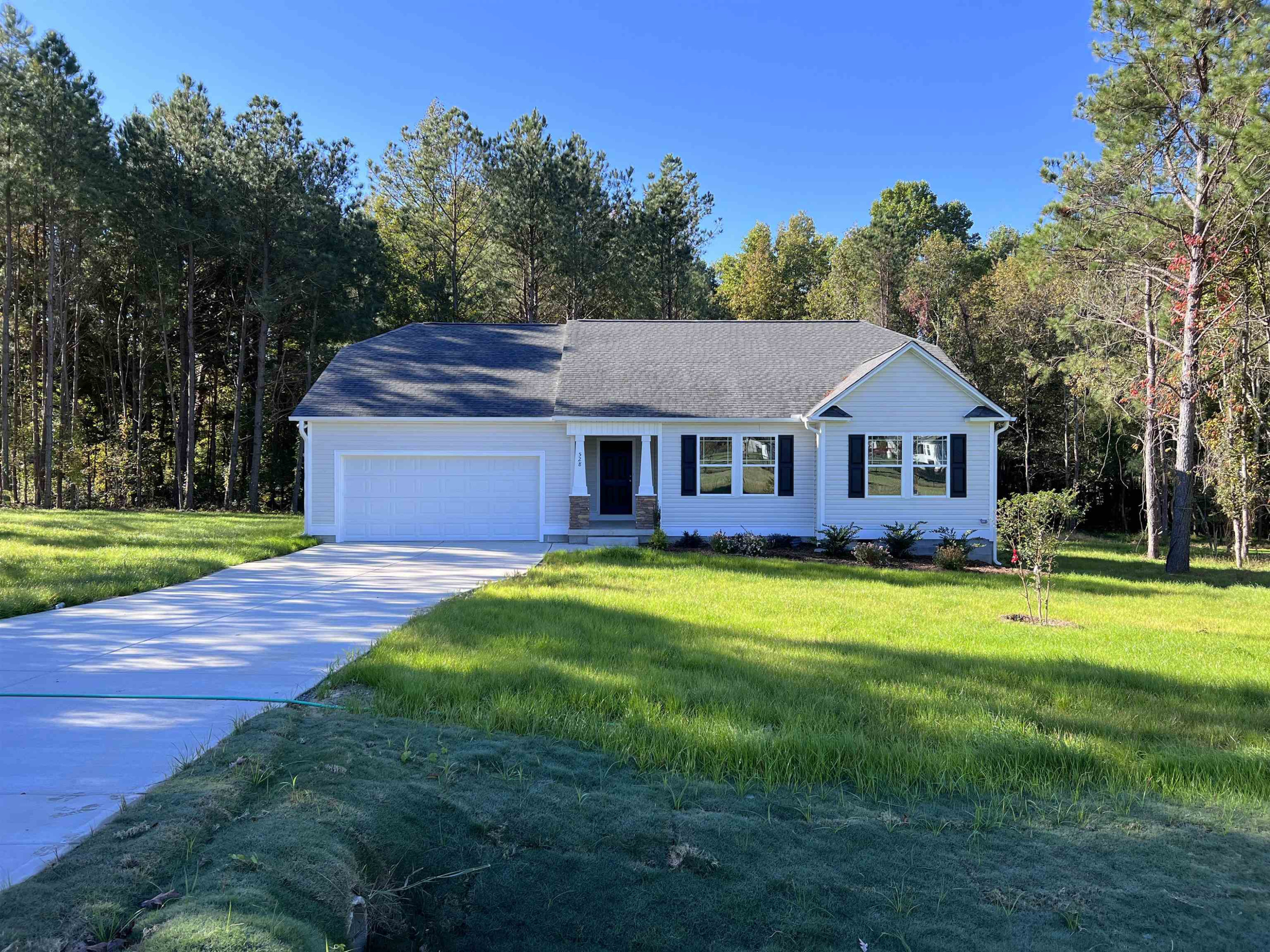 528 Roberts Road Willow Spring, NC 27592 - Photo 1 of 19 a front view of a house with a yard