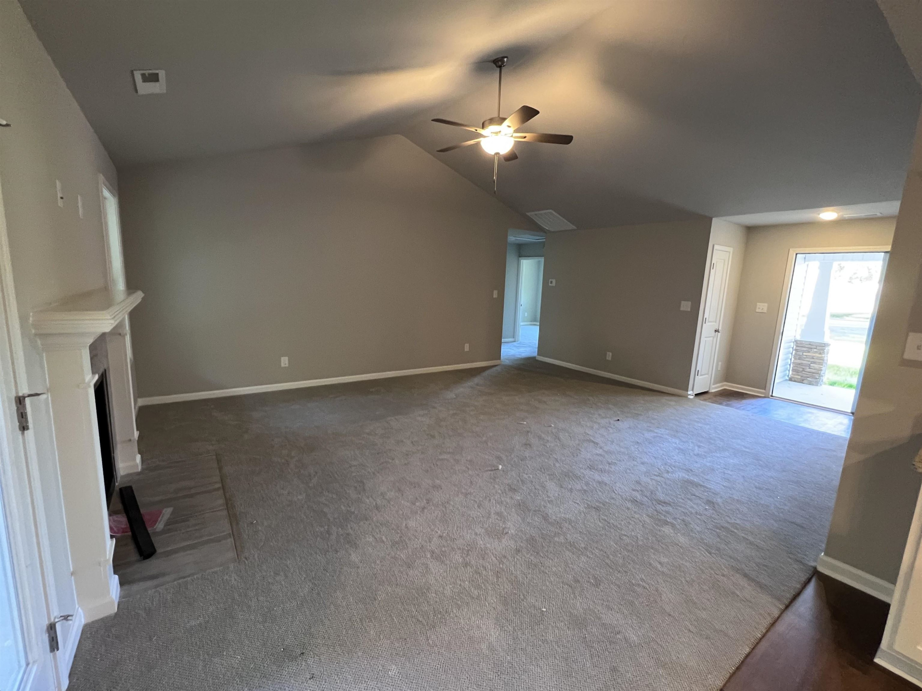 528 Roberts Road Willow Spring, NC 27592 - Photo 4 of 19 wooden floor in an empty room with a mirror