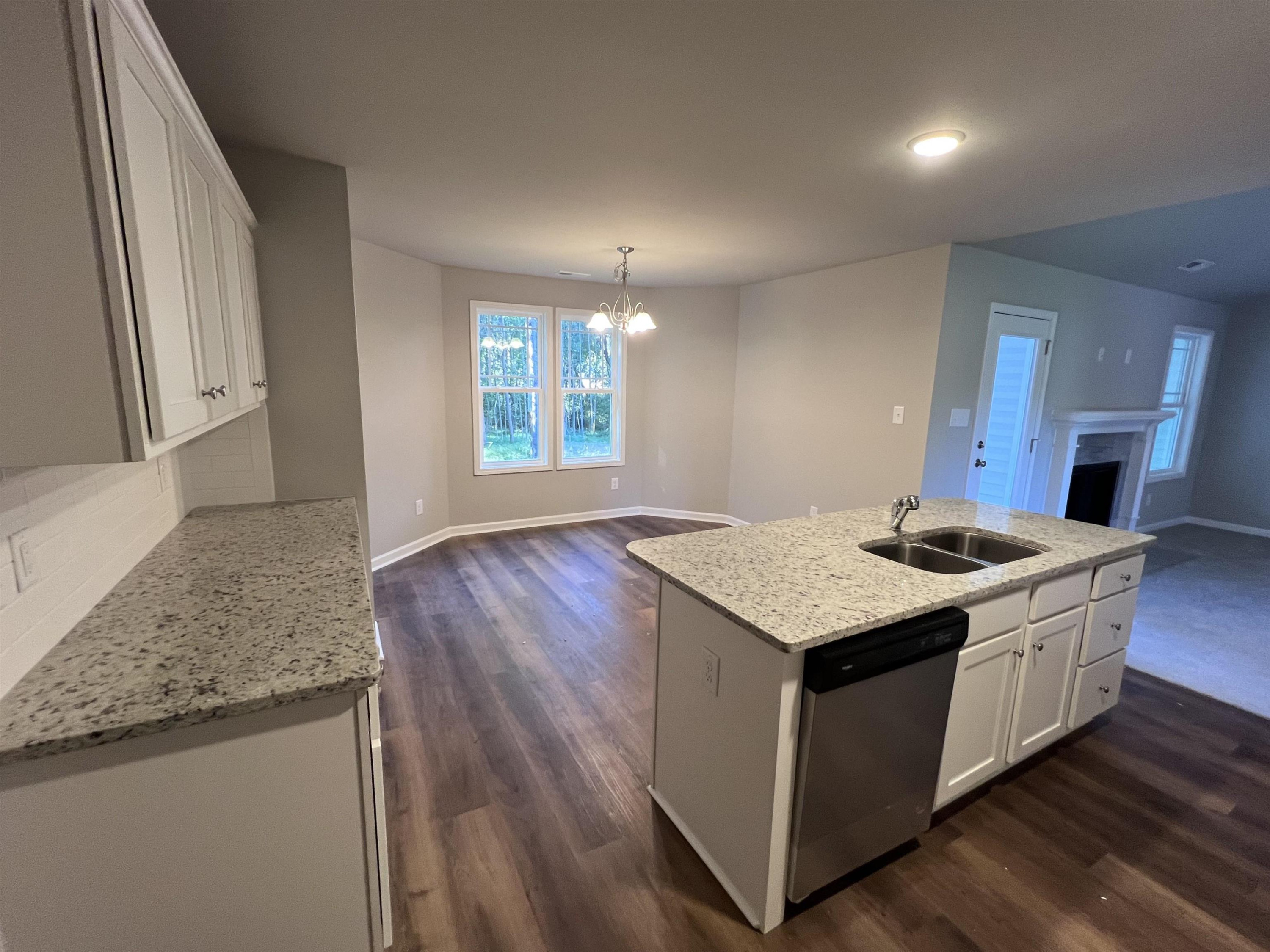 528 Roberts Road Willow Spring, NC 27592 - Photo 10 of 19 a kitchen with a stove and a sink
